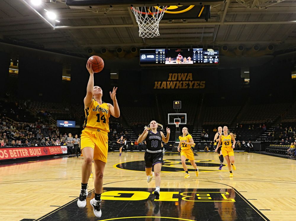 Iowa guard/forward McKenna Warnock (14) makes a basket during the second quarter of their game against Winona State at Carver-Hawkeye Arena in Iowa City on Sunday, Nov 3, 2019. (Stephen Mally/hawkeyesports.com)