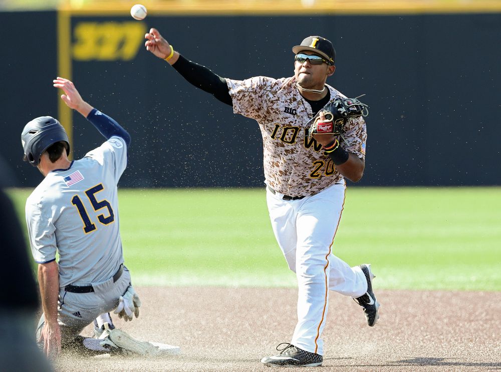 Iowa Hawkeyes second baseman Izaya Fullard (20) throws to first base as they turn a double play during the eighth inning of their game against UC Irvine at Duane Banks Field in Iowa City on Sunday, May. 5, 2019. (Stephen Mally/hawkeyesports.com)