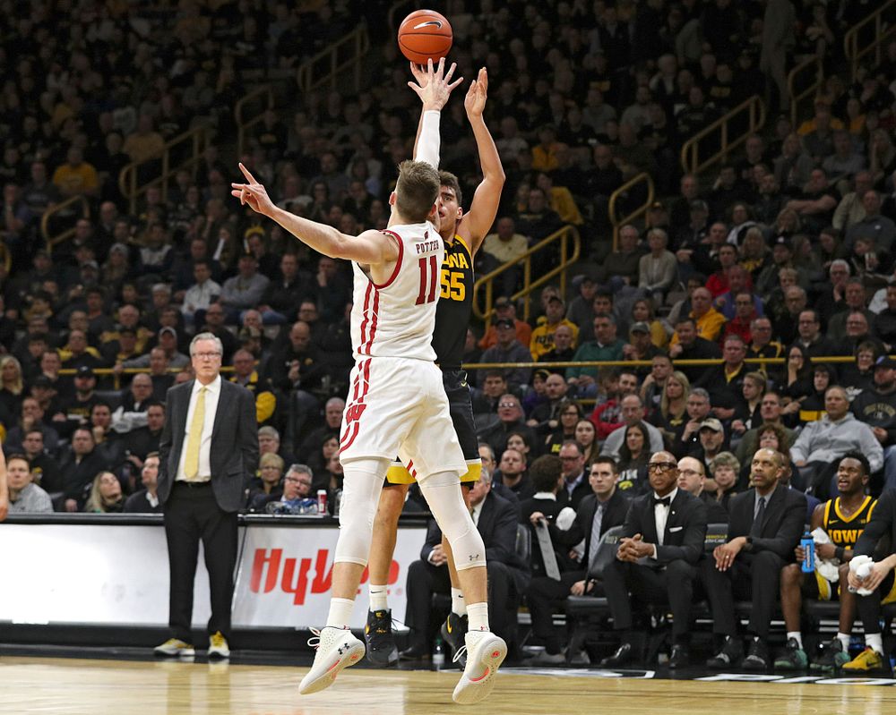 Iowa Hawkeyes center Luka Garza (55) makes a 3-pointer during the second half of their game at Carver-Hawkeye Arena in Iowa City on Monday, January 27, 2020. (Stephen Mally/hawkeyesports.com)
