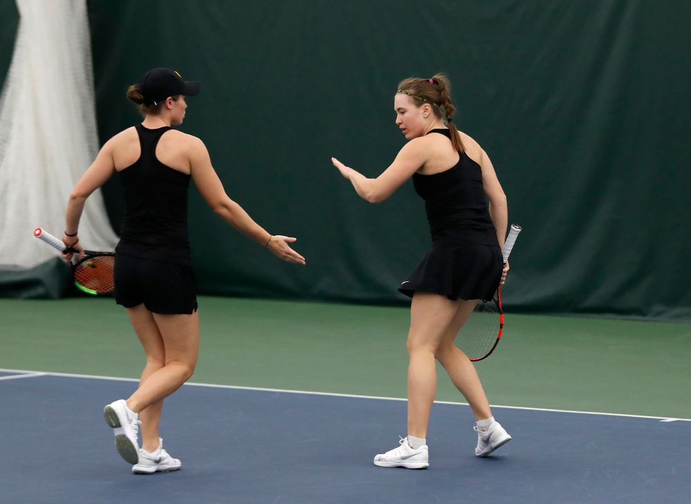 Elise Van Heuvelen and Anastasia Reimchen play a doubles match against Ohio State Sunday, March 25, 2018 at the Hawkeye Tennis and Recreation Center. (Brian Ray/hawkeyesports.com)