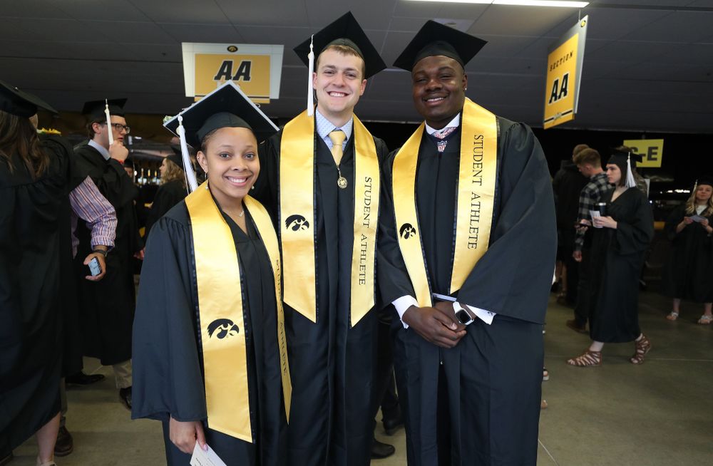 Iowa WoemenÕs BasketballÕs Tania Davis, SwimmingÕs Ben Colin, and FootballÕs James Daniels during the College of Liberal Arts and Sciences spring commencement Saturday, May 11, 2019 at Carver-Hawkeye Arena. (Brian Ray/hawkeyesports.com)