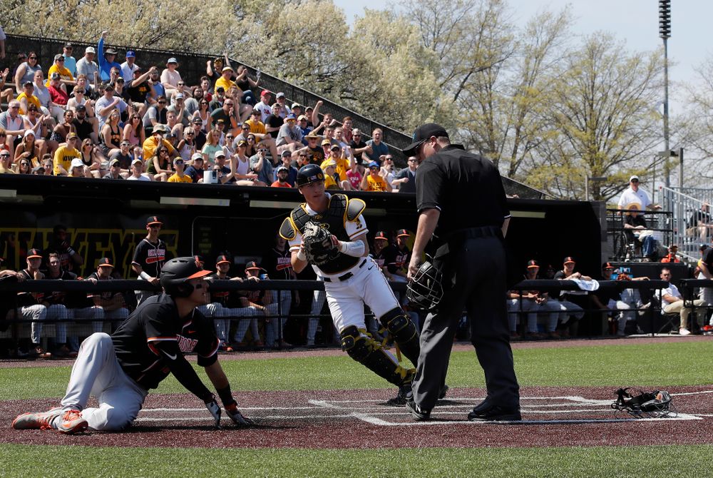 Iowa Hawkeyes catcher Tyler Cropley (5) tags out a runner at home against the Oklahoma State Cowboys Saturday, May 5, 2018 at Duane Banks Field. (Brian Ray/hawkeyesports.com)