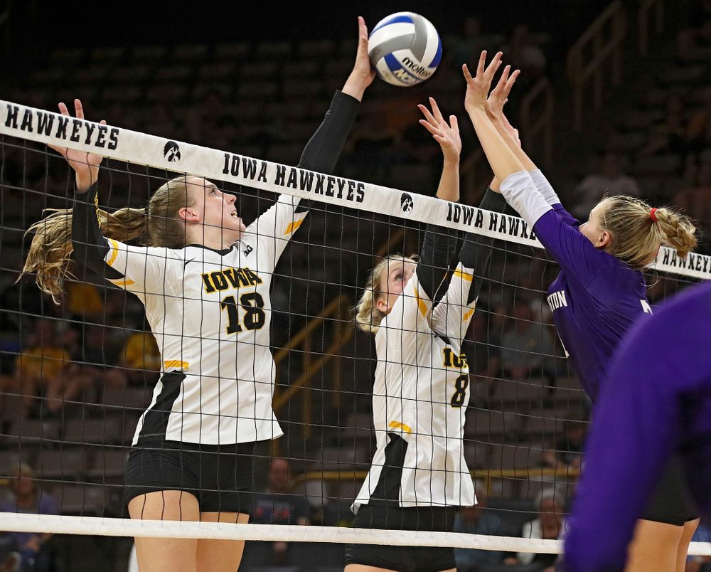 Iowa’s Hannah Clayton (18) gets her hand on a shot as Kyndra Hansen (8) looks on during their Big Ten/Pac-12 Challenge match at Carver-Hawkeye Arena in Iowa City on Saturday, Sep 7, 2019. (Stephen Mally/hawkeyesports.com)