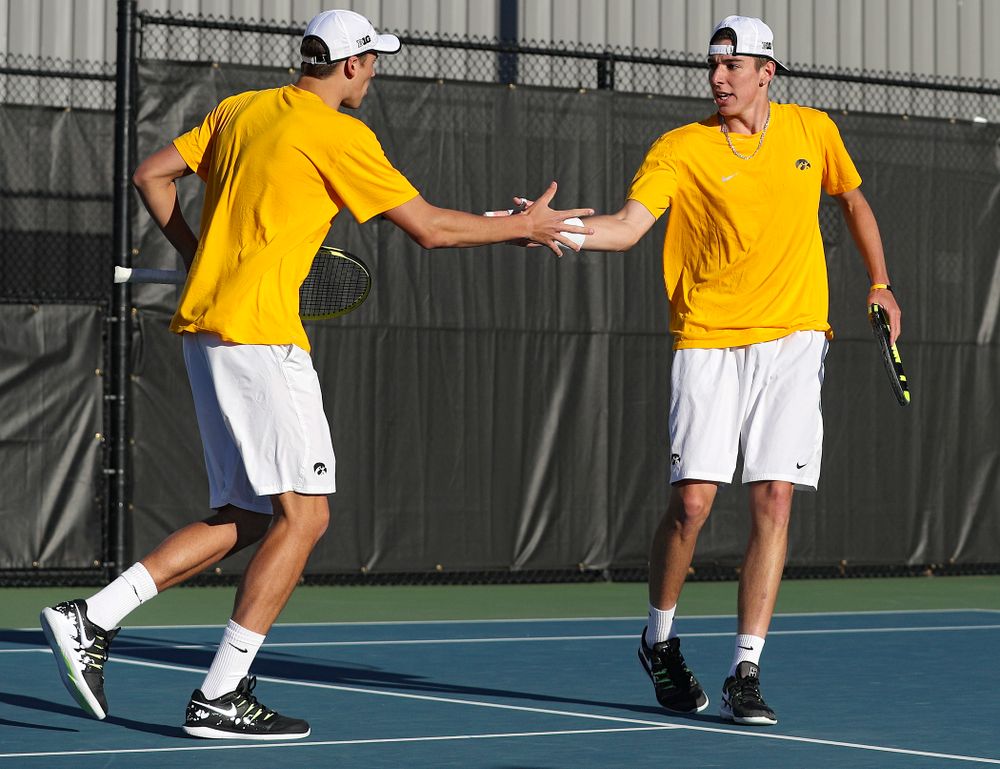 Iowa's Joe Tyler (from left) and Nikita Snezhko celebrate a point during their doubles match again Michigan State at the Hawkeye Tennis and Recreation Complex in Iowa City on Friday, Apr. 19, 2019. (Stephen Mally/hawkeyesports.com)