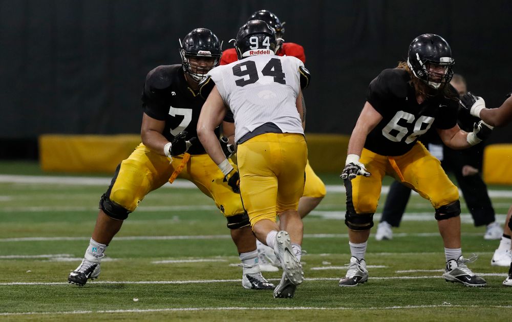 Iowa Hawkeyes offensive lineman Tristan Wirfs (74), offensive lineman Landan Paulsen (68), and defensive end A.J. Epenesa (94) during spring practice No. 13 Wednesday, April 18, 2018 at the Hansen Football Performance Center. (Brian Ray/hawkeyesports.com)