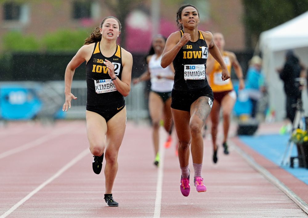 Iowa's Jenny Kimbro (from left) and Tria Simmons run in the women’s 800 meter in the heptathlon event on the second day of the Big Ten Outdoor Track and Field Championships at Francis X. Cretzmeyer Track in Iowa City on Saturday, May. 11, 2019. (Stephen Mally/hawkeyesports.com)