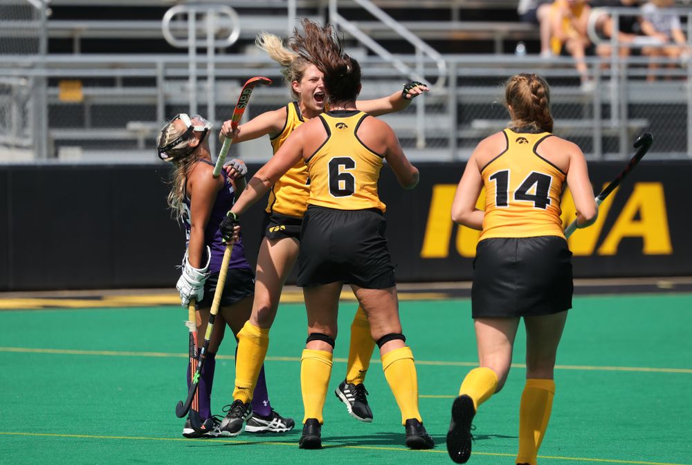 Iowa Hawkeyes defenseman Anthe Nijziel (6) and Ellie Holley (7) celebrate after scoring on a penalty corner during an exhibition game against Northwestern Saturday, August 24, 2019 at Grant Field. (Brian Ray/hawkeyesports.com)