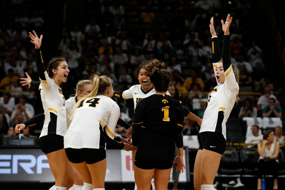Iowa Hawkeyes middle blocker Sarah Wing (13) and outside hitter Meghan Buzzerio (5) against the Michigan State Spartans Friday, September 21, 2018 at Carver-Hawkeye Arena. (Brian Ray/hawkeyesports.com)