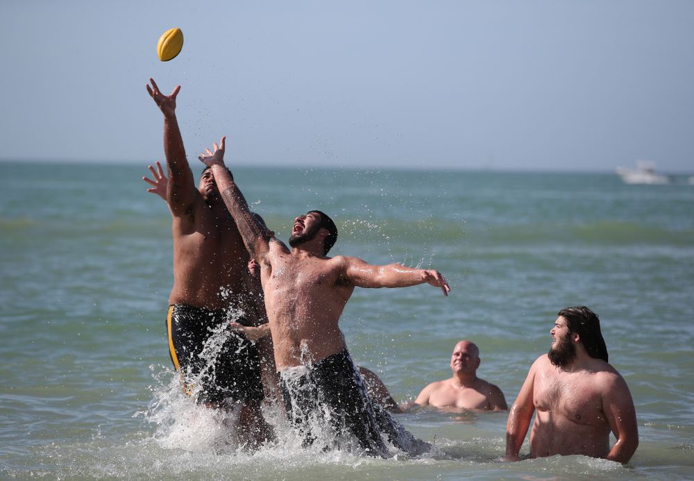 Iowa Hawkeyes offensive lineman Tristan Wirfs (74) and defensive end A.J. Epenesa (94) during the Outback Bowl Beach Day Sunday, December 30, 2018 at Clearwater Beach. (Brian Ray/hawkeyesports.com)