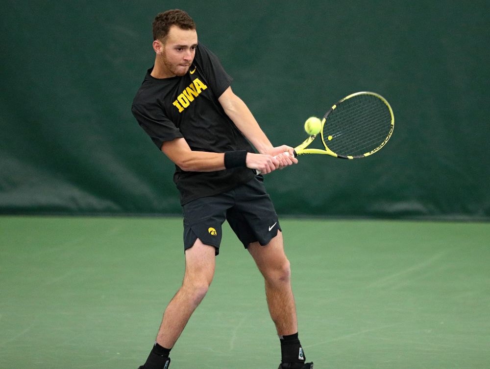 Iowa’s Kareem Allaf hits a shot during their doubles match against Marquette at the Hawkeye Tennis and Recreation Complex in Iowa City on Saturday, January 25, 2020. (Stephen Mally/hawkeyesports.com)