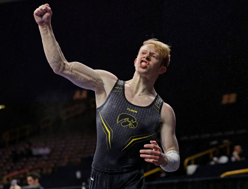 Iowa's Nick Merryman pumps his fist after competing in the pommel during the first day of the Big Ten Men's Gymnastics Championships at Carver-Hawkeye Arena in Iowa City on Friday, Apr. 5, 2019. (Stephen Mally/hawkeyesports.com)