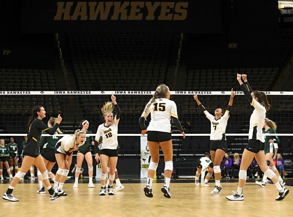 Iowa’s Halle Johnston (4), Kyndra Hansen (8), Hannah Clayton (18), Maddie Slagle (15), Brie Orr (7), and Courtney Buzzerio (2) celebrate a score during the second set of their volleyball match at Carver-Hawkeye Arena in Iowa City on Sunday, Oct 13, 2019. (Stephen Mally/hawkeyesports.com)