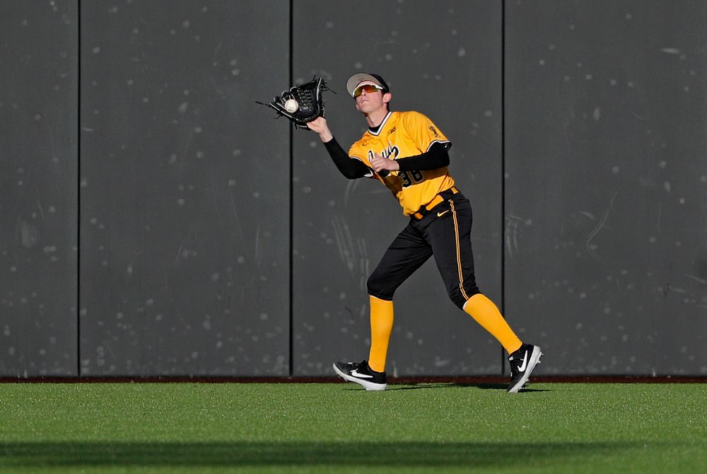 Iowa Hawkeyes right fielder Trenton Wallace (38) pulls in a fly ball for an out during the seventh inning of their game at Duane Banks Field in Iowa City on Tuesday, Apr. 2, 2019. (Stephen Mally/hawkeyesports.com)