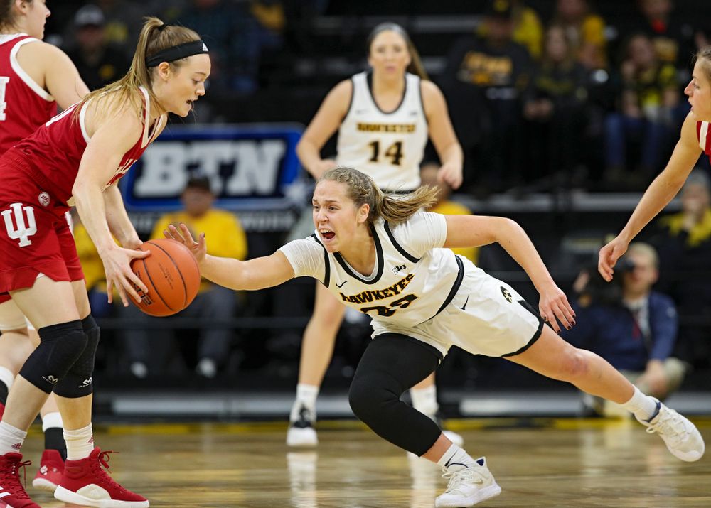 Iowa Hawkeyes guard Kathleen Doyle (22) tries to knock the ball away from Indiana Hoosiers forward Brenna Wise (50) during the first quarter of their game at Carver-Hawkeye Arena in Iowa City on Sunday, January 12, 2020. (Stephen Mally/hawkeyesports.com)