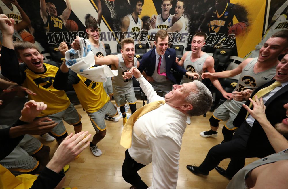 Iowa Hawkeyes assistant coach Kirk Speraw dances with the team following their win against the Iowa State Cyclones in the Iowa Corn Cy-Hawk Series Thursday, December 6, 2018 at Carver-Hawkeye Arena. (Brian Ray/hawkeyesports.com)
