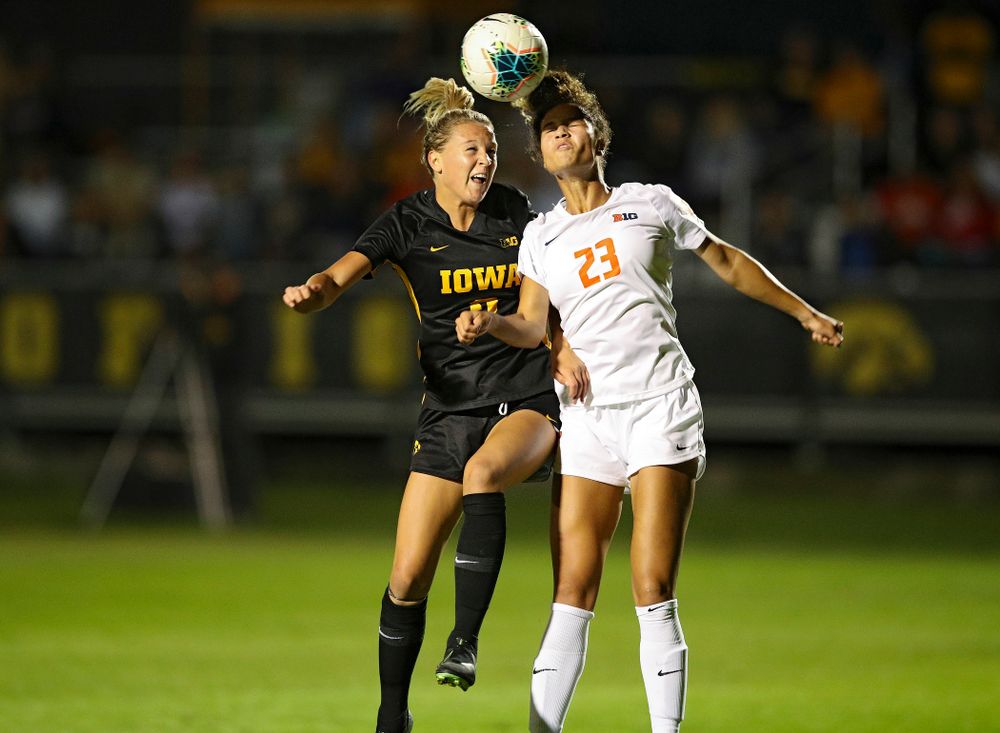 Iowa midfielder Hailey Rydberg (2) battles for a header during the second half of their match against Illinois at the Iowa Soccer Complex in Iowa City on Thursday, Sep 26, 2019. (Stephen Mally/hawkeyesports.com)