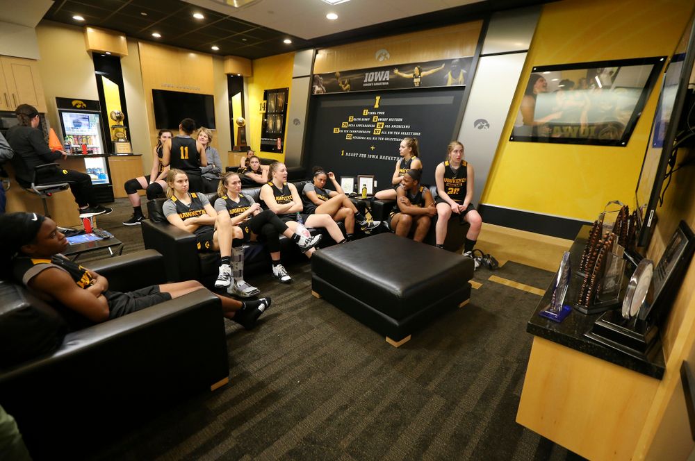 The Iowa Hawkeyes watch a basketball game on the television during media availability before their next game in the 2019 NCAA Women's Basketball Tournament at Carver Hawkeye Arena in Iowa City on Saturday, Mar. 23, 2019. (Stephen Mally for hawkeyesports.com)
