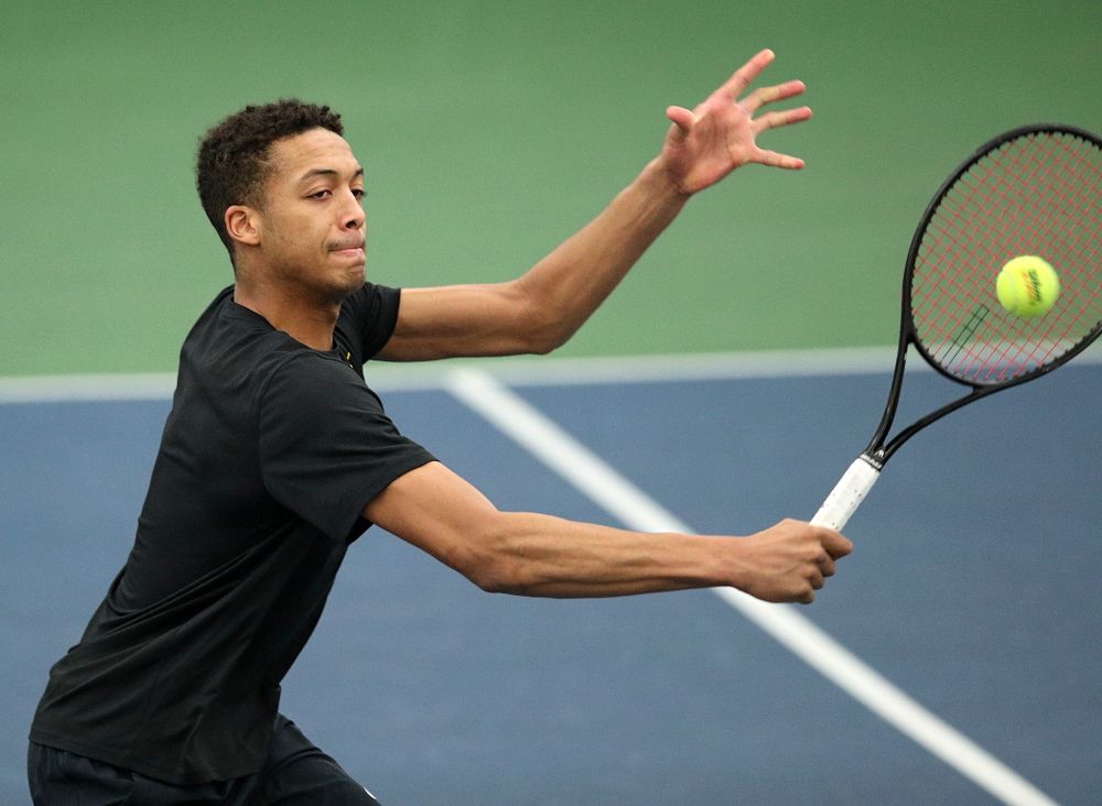 Iowa’s Oliver Okonkwo returns a shot during his doubles match at the Hawkeye Tennis and Recreation Complex in Iowa City on Friday, March 6, 2020. (Stephen Mally/hawkeyesports.com)