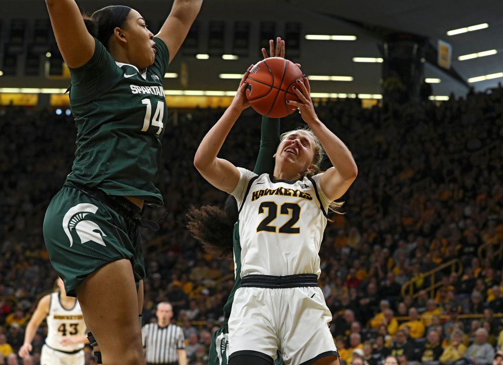Iowa Hawkeyes guard Kathleen Doyle (22) makes a basket while being fouled during the first quarter of their game at Carver-Hawkeye Arena in Iowa City on Sunday, January 26, 2020. (Stephen Mally/hawkeyesports.com)