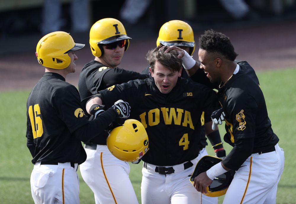 Iowa Hawkeyes infielder Mitchell Boe (4) reacts after hitting a game tying three-run homer against California State Northridge Sunday, March 17, 2019 at Duane Banks Field. (Brian Ray/hawkeyesports.com)