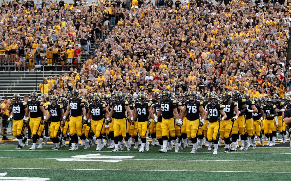 The Iowa Hawkeyes Swarm onto the field for their game against the Iowa State Cyclones Saturday, September 8, 2018 at Kinnick Stadium. (Brian Ray/hawkeyesports.com)