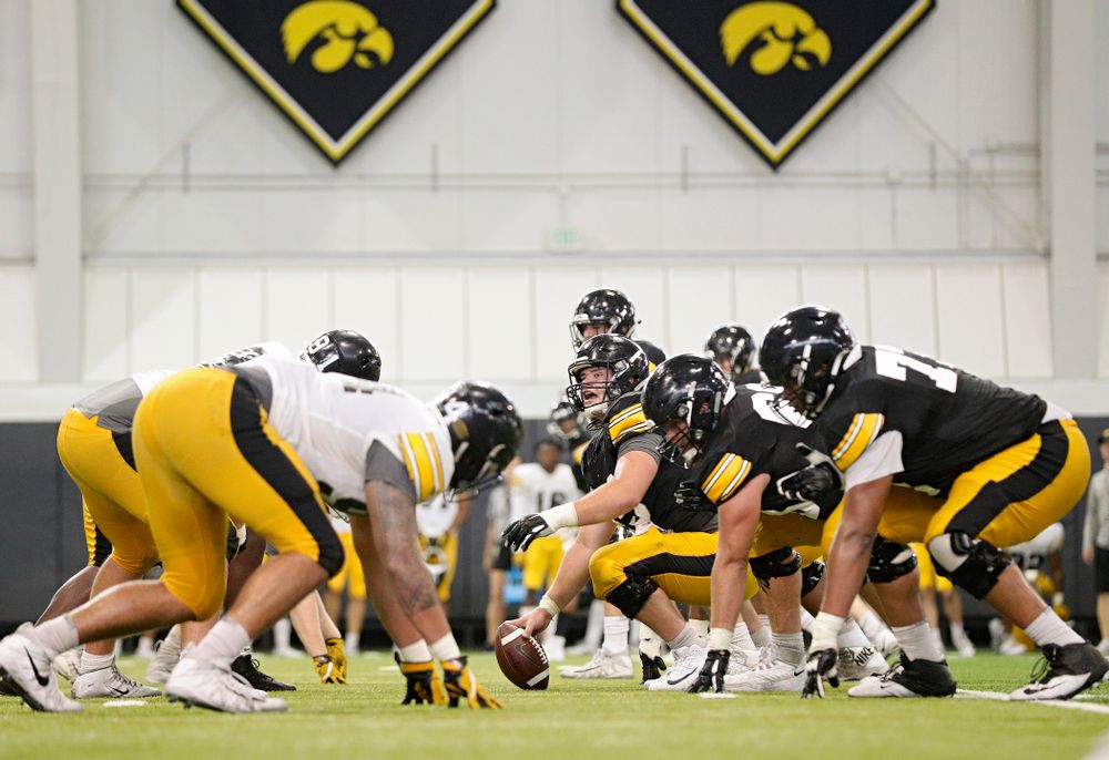 Iowa Hawkeyes offensive lineman Tyler Linderbaum (65) calls out at the line before snapping the ball during Fall Camp Practice No. 6 at the Hansen Football Performance Center in Iowa City on Thursday, Aug 8, 2019. (Stephen Mally/hawkeyesports.com)