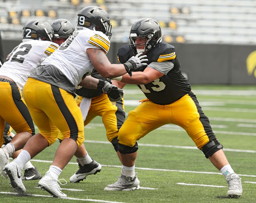 Iowa Hawkeyes offensive lineman Cody Ince (right) looks to block defensive lineman Noah Shannon (99) during Fall Camp Practice No. 8 at Kids Day at Kinnick Stadium in Iowa City on Saturday, Aug 10, 2019. (Stephen Mally/hawkeyesports.com)