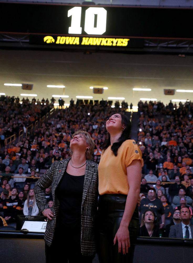 Megan Gustafson watches a video with head coach Lisa Bluder during a jersey retirement ceremony Sunday, January 26, 2020 at Carver-Hawkeye Arena. (Brian Ray/hawkeyesports.com)