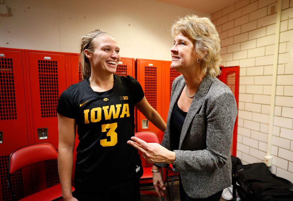 Iowa Hawkeyes guard Makenzie Meyer (3) and head coach Lisa Bluder  
