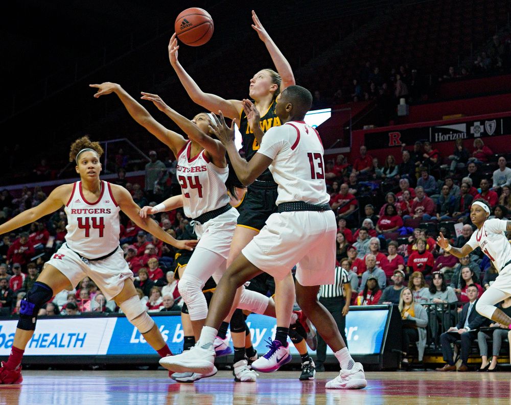 Iowa forward Amanda Ollinger (43) pulls in a rebound during the third quarter of their game at the Rutgers Athletic Center in Piscataway, N.J. on Sunday, March 1, 2020. (Stephen Mally/hawkeyesports.com)