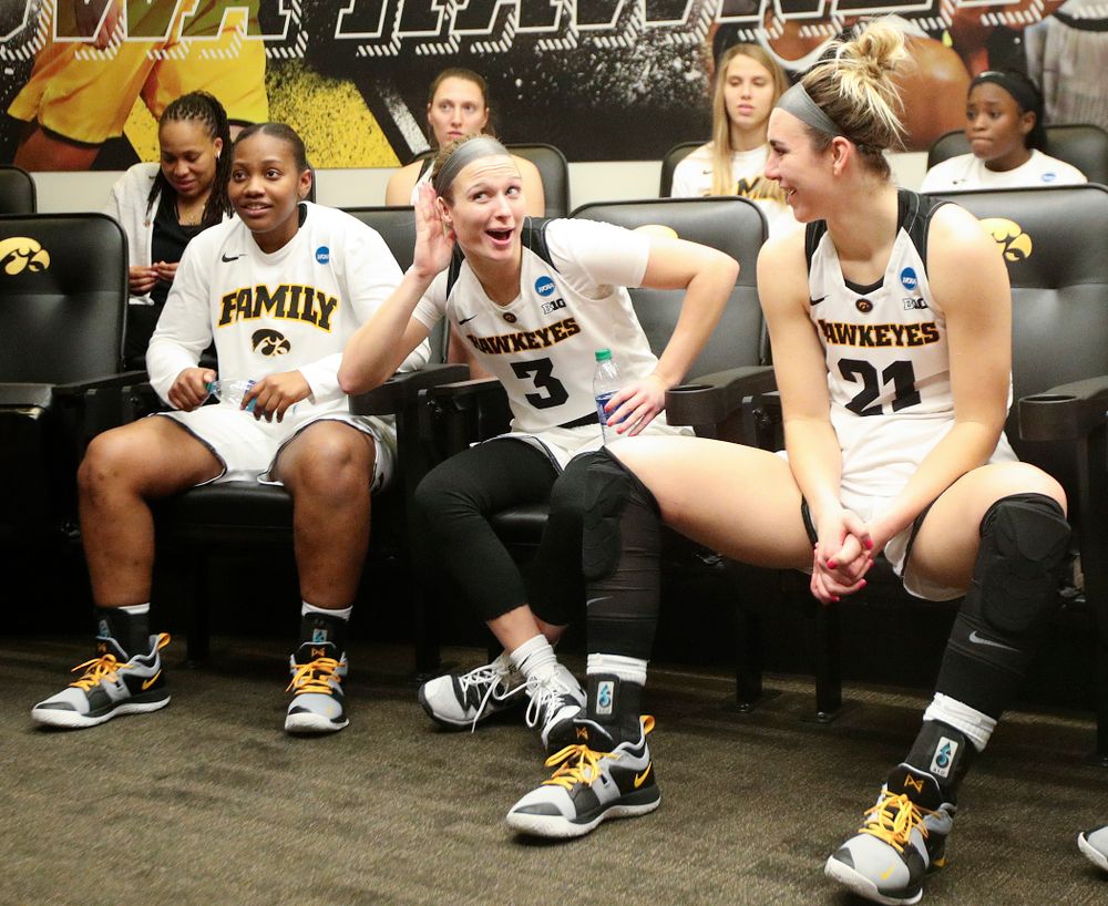 Iowa Hawkeyes guard Makenzie Meyer (3) motions as she talks about how loud the crowd was as she sits with her team in the locker room after winning their second round game in the 2019 NCAA Women's Basketball Tournament at Carver Hawkeye Arena in Iowa City on Sunday, Mar. 24, 2019. (Stephen Mally for hawkeyesports.com)