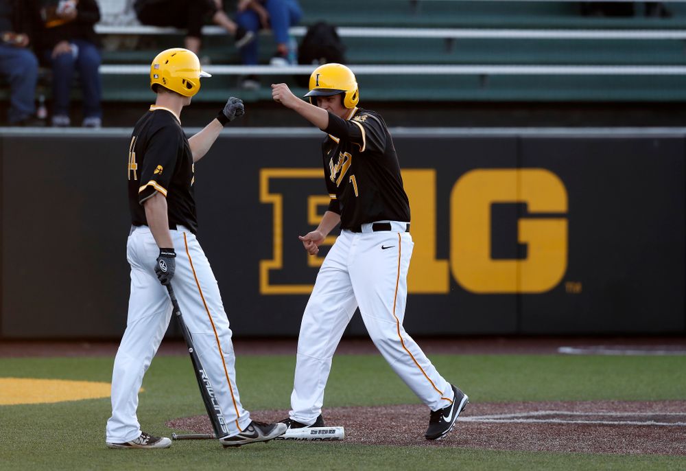 Iowa Hawkeyes pitcher Grant Judkins (7) and outfielder Robert Neustrom (44) against Milwaukee Wednesday, April 25, 2018 at Duane Banks Field. (Brian Ray/hawkeyesports.com)