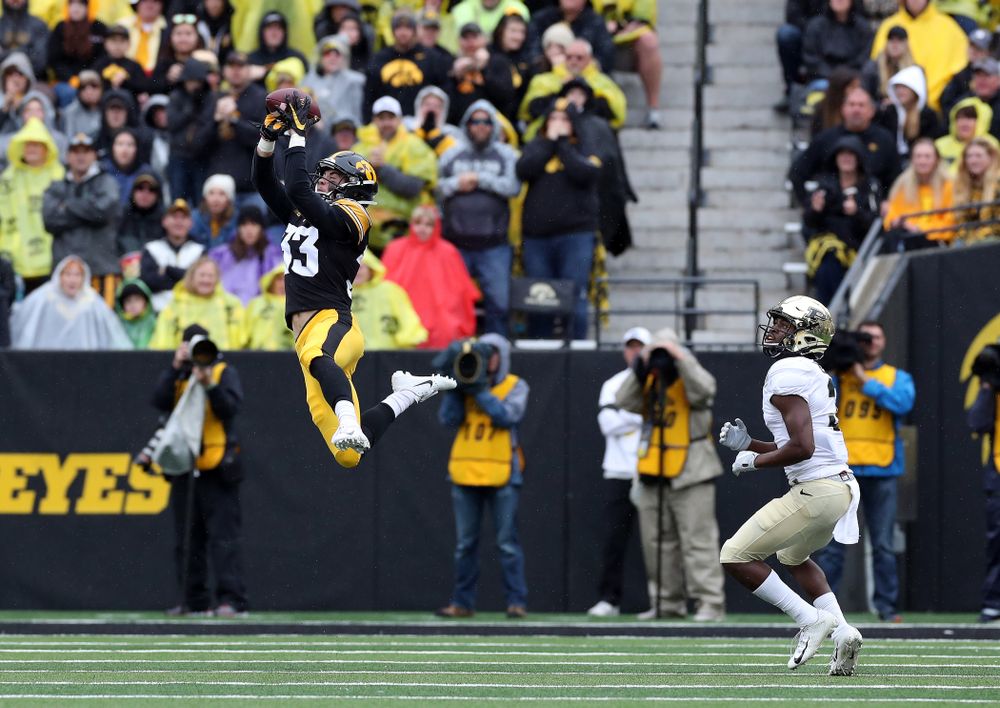 Iowa Hawkeyes defensive back Riley Moss (33) intercepts a pass against the Purdue Boilermakers Saturday, October 19, 2019 at Kinnick Stadium. (Brian Ray/hawkeyesports.com)