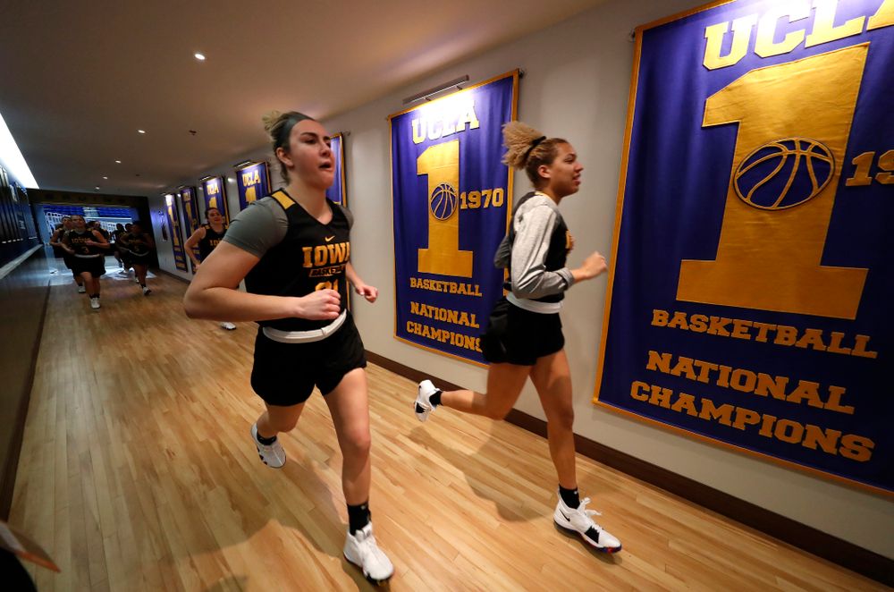 The Iowa Hawkeyes warmup before practice Friday, March 16, 2018 in the hallways of Pauley Pavilion on the campus of UCLA. (Brian Ray/hawkeyesports.com)
