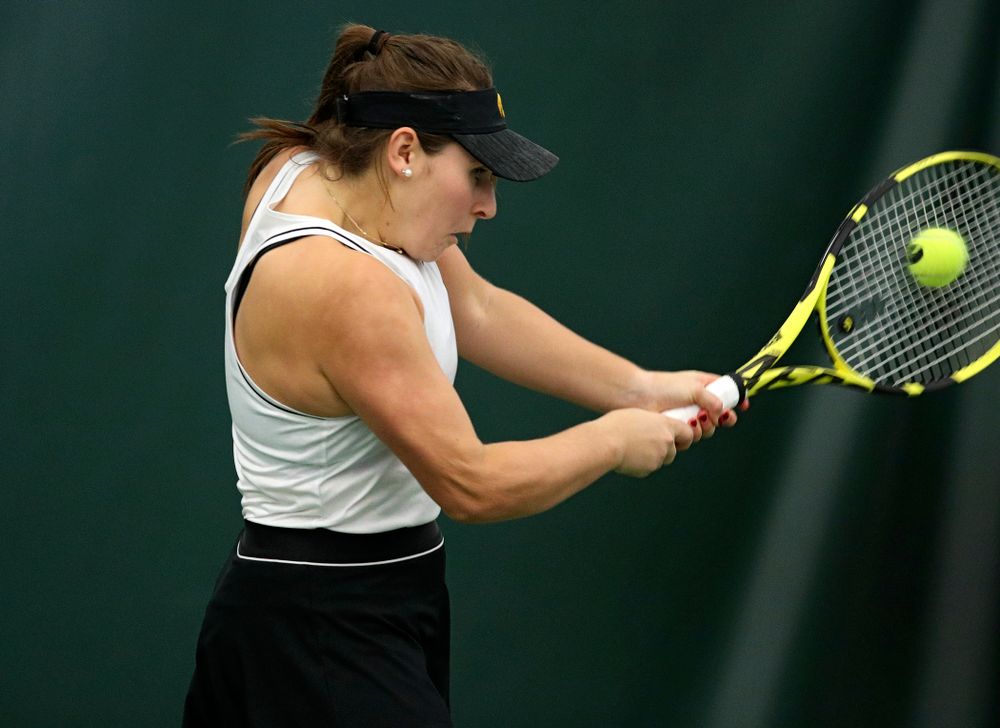 Iowa’s Danielle Bauers returns a shot during her doubles match at the Hawkeye Tennis and Recreation Complex in Iowa City on Sunday, February 16, 2020. (Stephen Mally/hawkeyesports.com)
