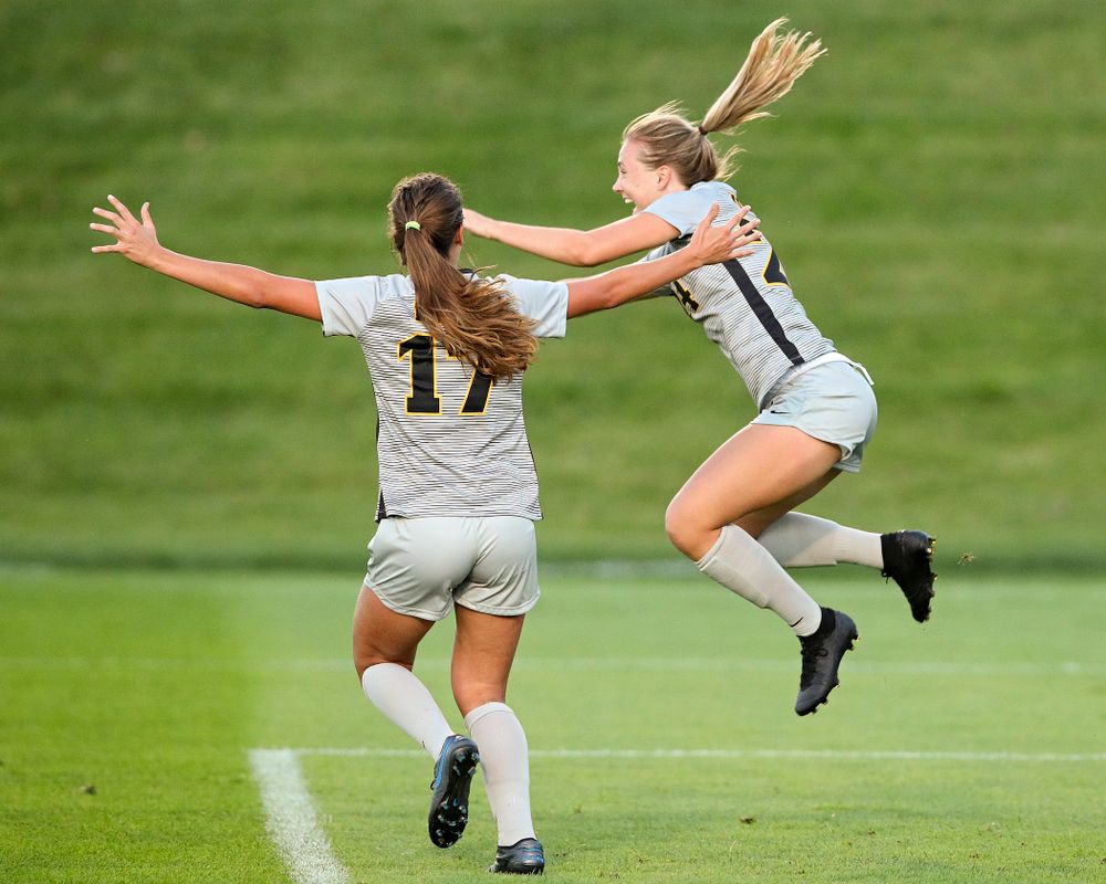 Iowa defender Sara Wheaton (24) celebrates with defender Hannah Drkulec (17) after scoring a goal during the first half of their match at the Iowa Soccer Complex in Iowa City on Friday, Sep 13, 2019. (Stephen Mally/hawkeyesports.com)