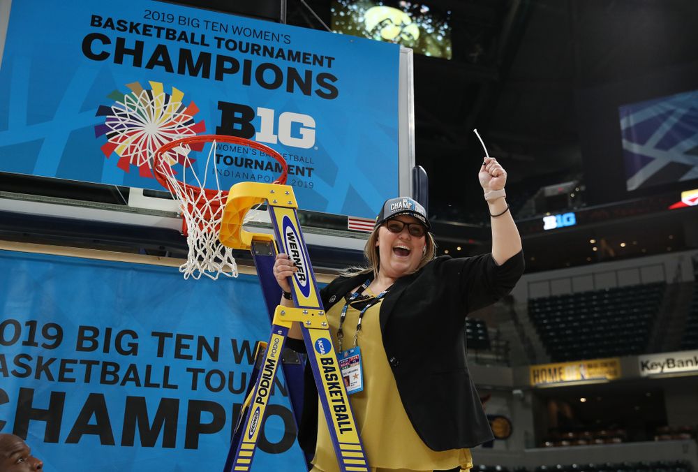 Women's Basketball SID cuts down the net as they celebrate their victory over the Maryland Terrapins in the Big Ten Championship Game Sunday, March 10, 2019 at Bankers Life Fieldhouse in Indianapolis, Ind. (Brian Ray/hawkeyesports.com)