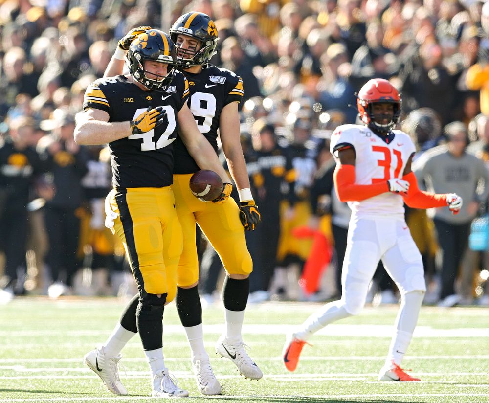 Iowa Hawkeyes tight end Shaun Beyer (42) celebrates with tight end Nate Wieting (39) after Beyer pulled in a pass during the second quarter of their game at Kinnick Stadium in Iowa City on Saturday, Nov 23, 2019. (Stephen Mally/hawkeyesports.com)