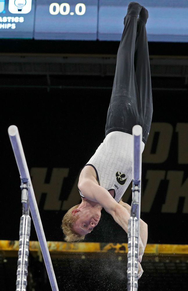Iowa's Nick Merryman competes in the parallel bars during the second day of the Big Ten Men's Gymnastics Championships at Carver-Hawkeye Arena in Iowa City on Saturday, Apr. 6, 2019. (Stephen Mally/hawkeyesports.com)