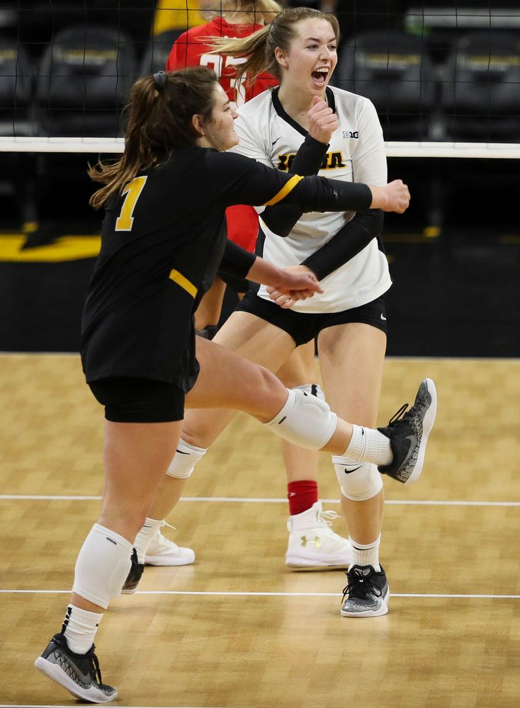 Iowa Hawkeyes defensive specialist Molly Kelly (1) and Iowa Hawkeyes outside hitter Meghan Buzzerio (5) celebrate after winning a point during a match against Maryland at Carver-Hawkeye Arena on November 23, 2018. (Tork Mason/hawkeyesports.com)