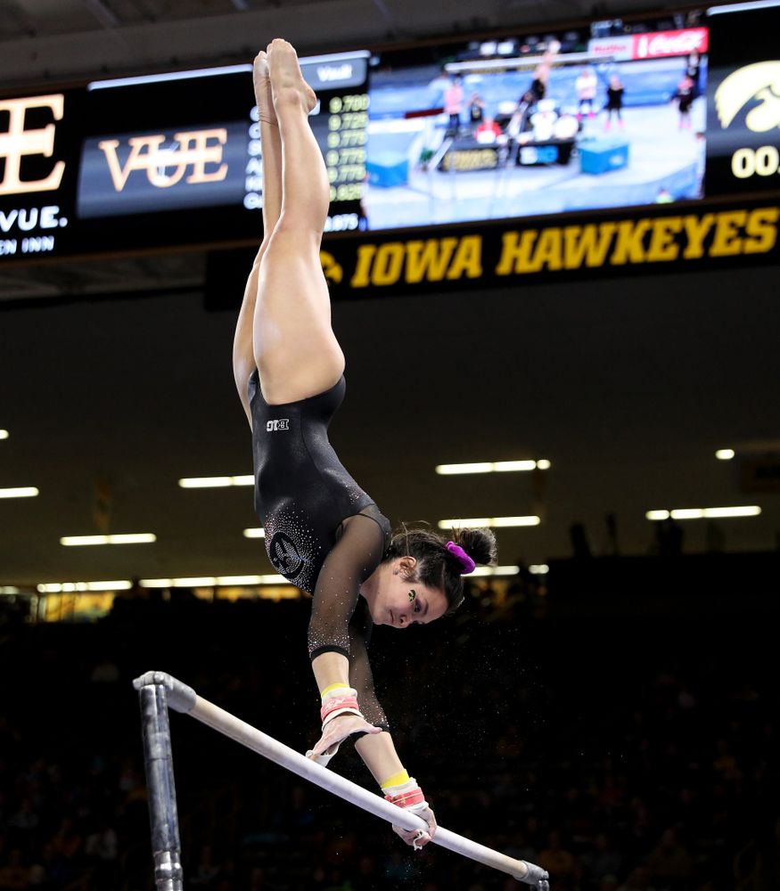 Iowa’s Carina Tolan competes on the bars against Michigan Friday, February 14, 2020 at Carver-Hawkeye Arena. (Brian Ray/hawkeyesports.com)