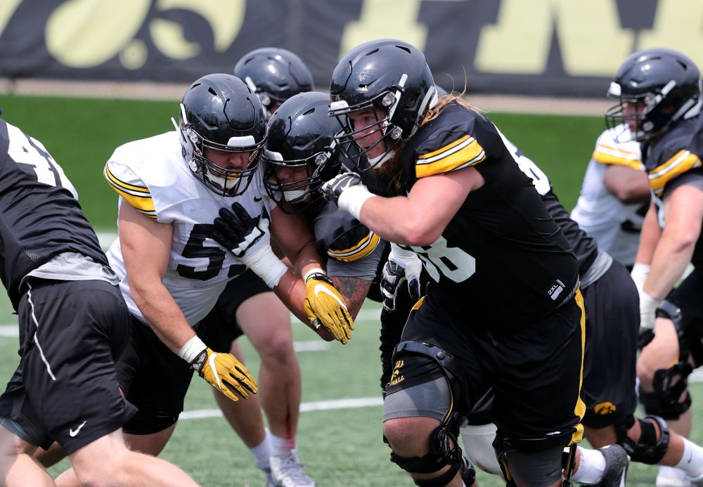 Iowa Hawkeyes offensive lineman Landan Paulsen (68) and offensive lineman Kyler Schott (64) during the third practice of fall camp Sunday, August 5, 2018 at the Kenyon Football Practice Facility. (Brian Ray/hawkeyesports.com)