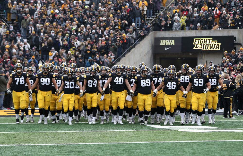 The Iowa Hawkeyes swarm onto the field for their game against the Northwestern Wildcats Saturday, November 10, 2018 at Kinnick Stadium. (Brian Ray/hawkeyesports.com)