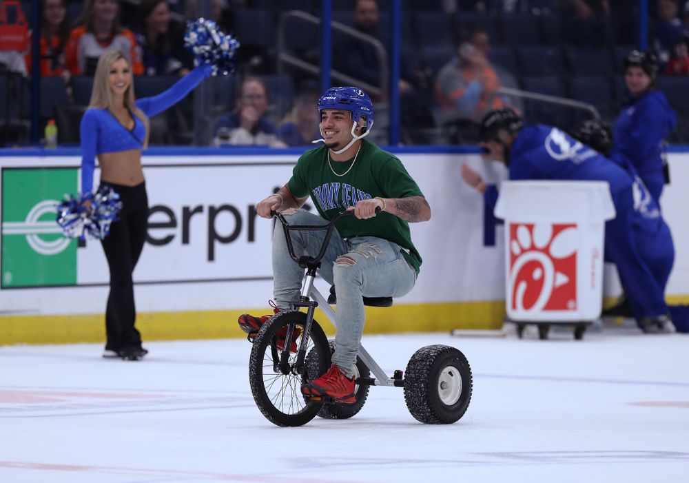 Iowa Hawkeyes defensive back Amani Hooker (27) rides a tricycle during a contest against Mississippi State in the first intermission of the Tampa Bay Lightning game Thursday, December 27, 2018 at Amalie Arena. (Brian Ray/hawkeyesports.com)