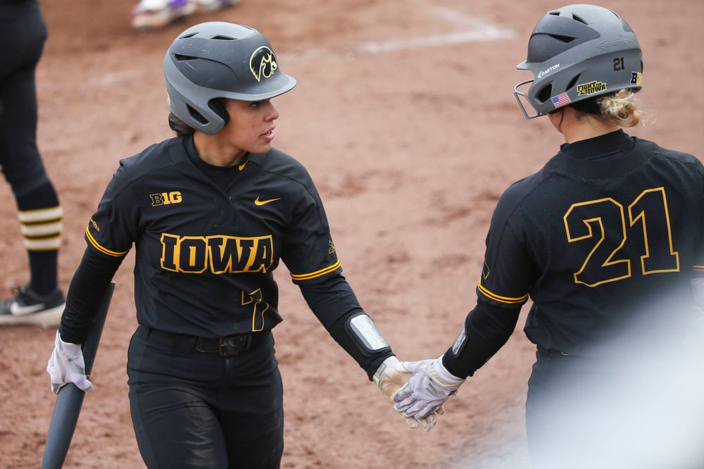 Iowa outfielder Lea Thompson (7) and Iowa's Havyn Monteer (21) at game 2 vs Northwestern on Saturday, March 30, 2019 at Bob Pearl Field. (Lily Smith/hawkeyesports.com)