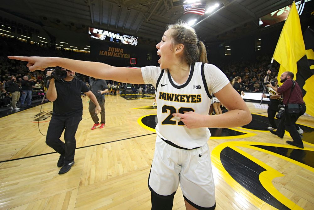 Iowa Hawkeyes guard Kathleen Doyle (22) points to the crowd as she celebrates after their double overtime win at Carver-Hawkeye Arena in Iowa City on Sunday, January 12, 2020. (Stephen Mally/hawkeyesports.com)