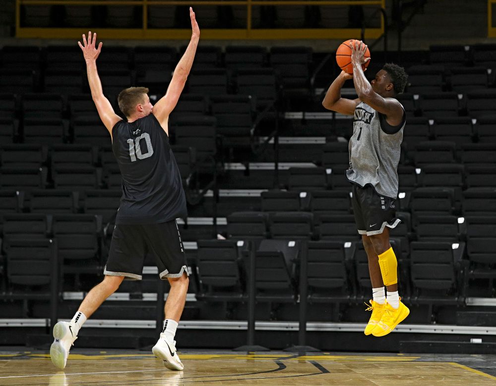 Iowa Hawkeyes guard Joe Toussaint (1) puts up a shot over the hand of guard Joe Wieskamp (10) during practice at Carver-Hawkeye Arena in Iowa City on Monday, Sep 30, 2019. (Stephen Mally/hawkeyesports.com)