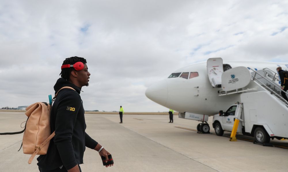 Iowa Hawkeyes forward Tyler Cook (25) boards a flight to Columbus for the first and second rounds of the 2019 NCAA Men's Basketball Tournament Wednesday, March 20, 2019 at the Eastern Iowa Airport. (Brian Ray/hawkeyesports.com)