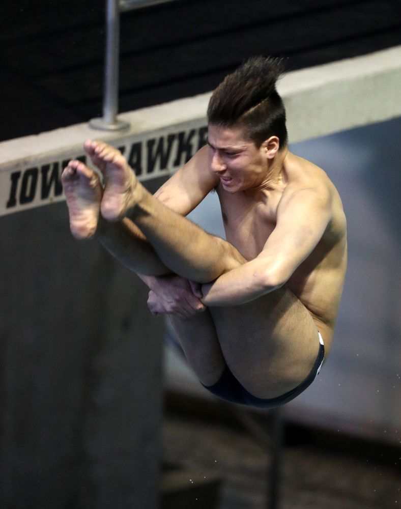 Iowa's Jonatan Posligua competes on the 1 meter springboard during a double dual against Wisconsin and Northwestern Saturday, January 19, 2019 at the Campus Recreation and Wellness Center. (Brian Ray/hawkeyesports.com)