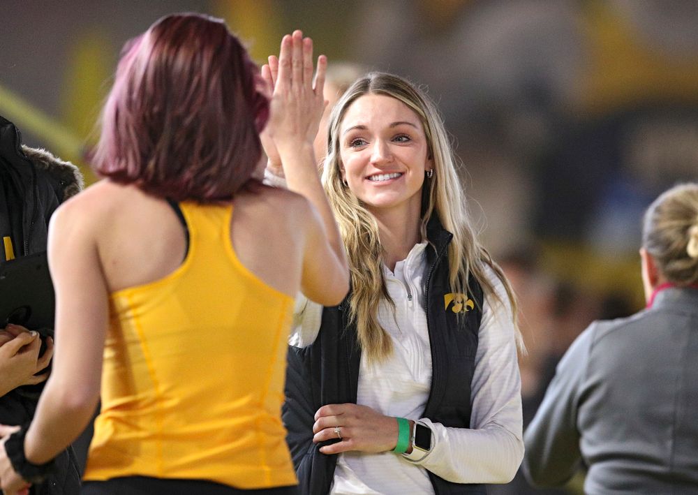 Iowa’s Aubrianna Lantrip (from left) gets a high five from assistant coach Paige Knodle after a jump in the women’s high jump event during the Hawkeye Invitational at the Recreation Building in Iowa City on Saturday, January 11, 2020. (Stephen Mally/hawkeyesports.com)